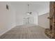 Spacious living area with a stone fireplace and high ceilings at 4011 Lafayette Way, Loganville, GA 30052