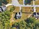 Aerial view of a house with a backyard and surrounding trees at 4011 Lafayette Way, Loganville, GA 30052