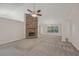 Bright living room with stone fireplace and ceiling fan at 4011 Lafayette Way, Loganville, GA 30052