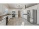Modern kitchen featuring stainless steel appliances and granite countertops at 4011 Lafayette Way, Loganville, GA 30052