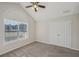 Bedroom with arched window, ceiling fan and double doors at 4011 Lafayette Way, Loganville, GA 30052