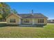 Large backyard with home's back elevation and patio at 4011 Lafayette Way, Loganville, GA 30052