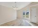 Spacious dining area with tile floors and French doors leading to patio at 4011 Lafayette Way, Loganville, GA 30052