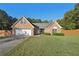Ranch-style brick home with a two-car garage and large yard at 4011 Lafayette Way, Loganville, GA 30052