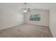 Well-lit bedroom with ceiling fan and window at 4011 Lafayette Way, Loganville, GA 30052