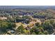 Aerial view of a neighborhood with various houses and trees at 4011 Lafayette Way, Loganville, GA 30052