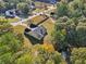 Aerial view of a house with a large backyard and surrounding trees at 4011 Lafayette Way, Loganville, GA 30052