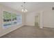 Bright dining room with tile flooring and large windows at 4011 Lafayette Way, Loganville, GA 30052