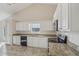 White kitchen cabinets and granite countertops at 4011 Lafayette Way, Loganville, GA 30052