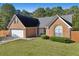Brick house with two-car garage and landscaped yard at 4011 Lafayette Way, Loganville, GA 30052