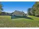 Large backyard with home's back elevation at 4011 Lafayette Way, Loganville, GA 30052