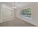 Spacious dining room with neutral decor and ample natural light at 4011 Lafayette Way, Loganville, GA 30052