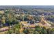 Aerial view of a house in a wooded neighborhood at 4011 Lafayette Way, Loganville, GA 30052