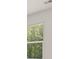 Window with blinds, showcasing backyard view at 619 Whitman (2200) Ln, Stockbridge, GA 30281