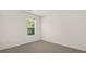 Well-lit bedroom with a window and carpeted floor at 619 Whitman (2200) Ln, Stockbridge, GA 30281