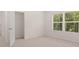 Bright bedroom with closet and window overlooking trees at 619 Whitman (2200) Ln, Stockbridge, GA 30281