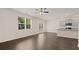 Open living room with hardwood floors, access to deck and kitchen at 619 Whitman (2200) Ln, Stockbridge, GA 30281