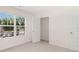 Bright bedroom featuring a large window and closet at 619 Whitman (2200) Ln, Stockbridge, GA 30281