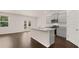 Modern kitchen with gray cabinets and granite island at 619 Whitman (2200) Ln, Stockbridge, GA 30281