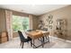 Home office with a large desk, two chairs, and built-in shelving at 619 Whitman (2200) Ln, Stockbridge, GA 30281