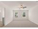 Spacious bedroom with ceiling fan and large windows offering natural light at 619 Whitman (2200) Ln, Stockbridge, GA 30281