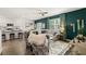 Open living room featuring hardwood floors, a neutral color palette, and a stylish sectional sofa at 619 Whitman (2200) Ln, Stockbridge, GA 30281