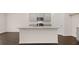 Kitchen island with granite countertop and hardwood floor at 619 Whitman (2200) Ln, Stockbridge, GA 30281