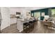 Modern kitchen with island, stainless steel appliances, and granite countertops at 619 Whitman (2200) Ln, Stockbridge, GA 30281