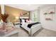Bright bedroom with carpeted floors, white bed frame, and gold accents at 619 Whitman (2200) Ln, Stockbridge, GA 30281