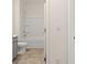 Clean bathroom with a shower/tub combo and gray vanity at 619 Whitman (2200) Ln, Stockbridge, GA 30281