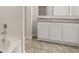 Bathroom features garden tub and double vanity with granite top at 569 Whitman (Lot 159) Ln, Stockbridge, GA 30281