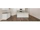 Kitchen with island and hardwood floors at 569 Whitman (Lot 159) Ln, Stockbridge, GA 30281