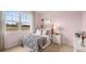 Charming bedroom with pink walls and a grey ruffled bedspread at 569 Whitman (Lot 159) Ln, Stockbridge, GA 30281
