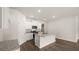 Open kitchen with island and granite countertops at 569 Whitman (Lot 159) Ln, Stockbridge, GA 30281