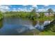 Peaceful pond surrounded by lush greenery and homes at 569 Whitman (Lot 159) Ln, Stockbridge, GA 30281