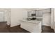 Modern kitchen with gray cabinets and granite countertops at 576 Whitman (2020) Ln, Stockbridge, GA 30281