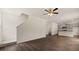 Living room features hardwood floors and access to kitchen and stairs at 576 Whitman (2020) Ln, Stockbridge, GA 30281