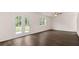 Bright living room with hardwood floors, sliding doors and ceiling fan at 576 Whitman (2020) Ln, Stockbridge, GA 30281