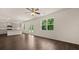 Open floor plan boasts a spacious kitchen and living area with hardwood floors at 576 Whitman (2020) Ln, Stockbridge, GA 30281