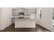 Modern kitchen with gray cabinets, granite countertops, and an island at 576 Whitman (2020) Ln, Stockbridge, GA 30281