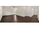 Spacious living room with hardwood floors and access to upper level at 576 Whitman (2020) Ln, Stockbridge, GA 30281