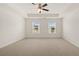 Spacious bedroom with ceiling fan and neutral carpeting at 576 Whitman (2020) Ln, Stockbridge, GA 30281