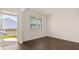 Spacious front room with dark hardwood floors and an exterior door at 576 Whitman (2020) Ln, Stockbridge, GA 30281