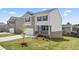 Two-story brick home with a charming front yard and attached garage at 576 Whitman (2020) Ln, Stockbridge, GA 30281