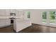 Modern kitchen with island, granite countertops, and stainless steel appliances at 576 Whitman (2020) Ln, Stockbridge, GA 30281