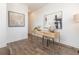 Light-filled home office with wood desk and hardwood floors at 348 Olmstead Way # 30, Alpharetta, GA 30022