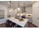 Modern kitchen with a large island and globe lighting at 348 Olmstead Way # 30, Alpharetta, GA 30022