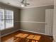 Well-lit bedroom with hardwood floors and ceiling fan at 1965 Tyler Trce, Lawrenceville, GA 30043
