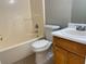 Small bathroom with tub, toilet, and vanity at 1965 Tyler Trce, Lawrenceville, GA 30043