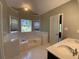 Bathroom boasts a garden tub, double vanity, and stained glass window at 1965 Tyler Trce, Lawrenceville, GA 30043